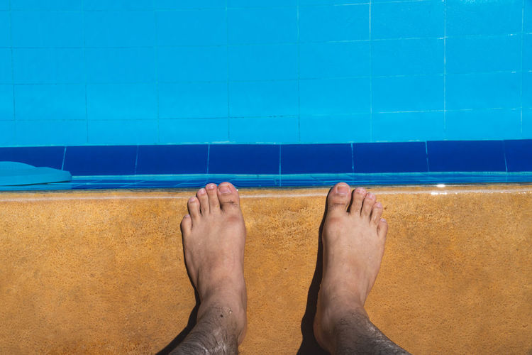 Low section of man in swimming pool
