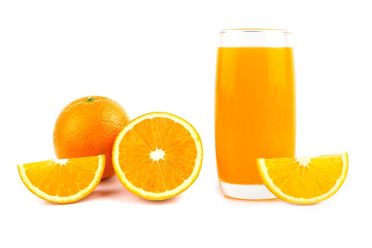 Orange fruits against white background