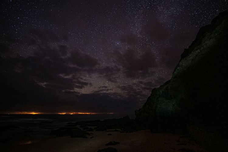 Scenic view of sea against sky at night
