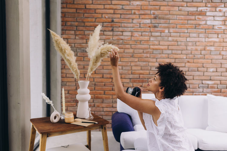 Black woman creating content with a camera