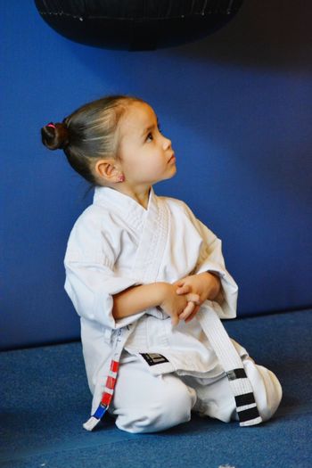 Girl kneeling at karate classes