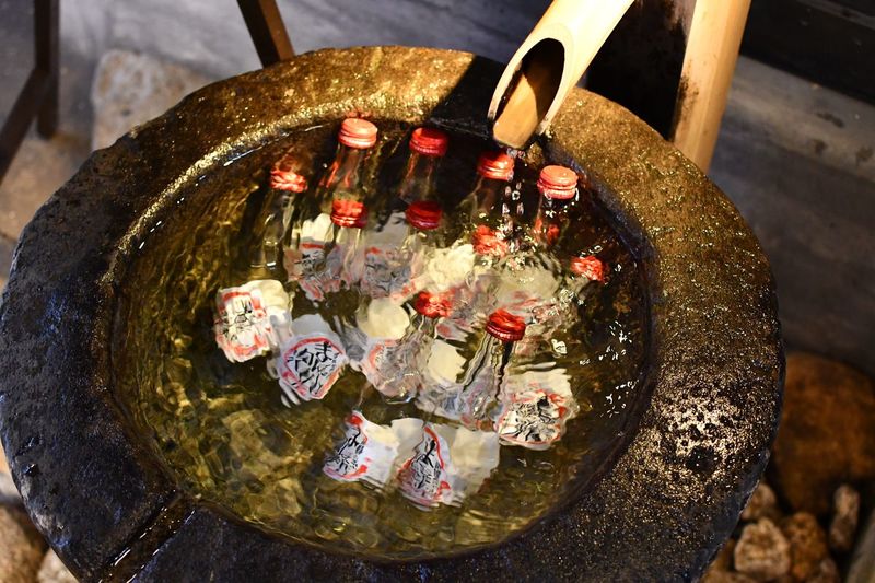 High angle view of candles in container at temple