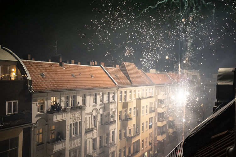 Fireworks explode and light up city streets at night in germany