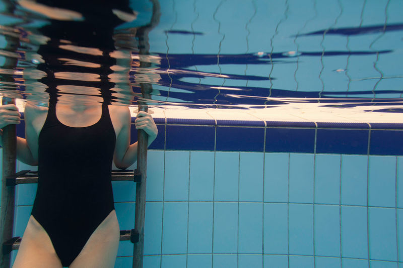 Female torso in the swimming pool