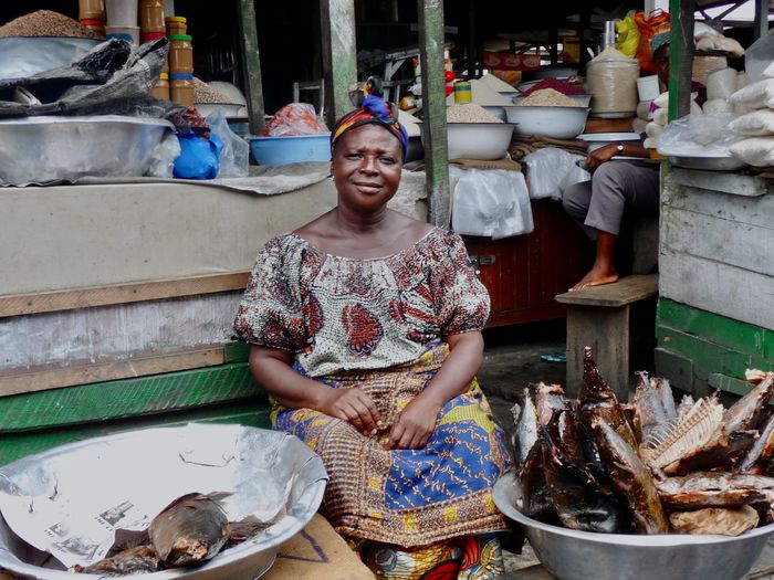 Portrait of woman preparing food at market
