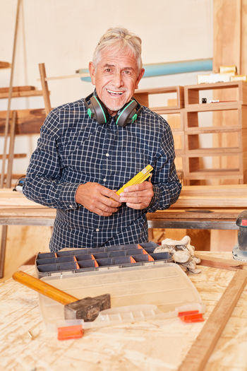 Portrait of senior carpenter at workshop