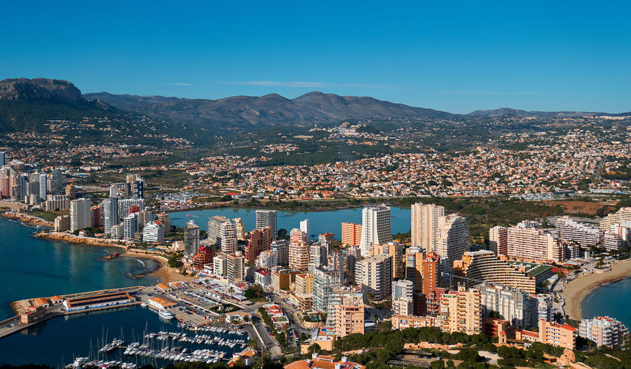 Aerial view of city and buildings against clear sky