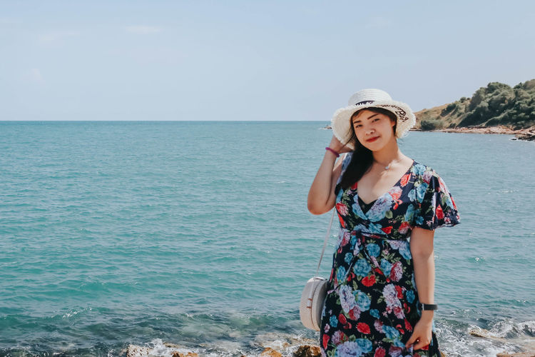 Pretty asian woman with beautiful sea view.