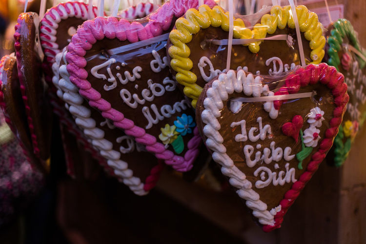 Close-up of heart shape sweet food hanging for sale