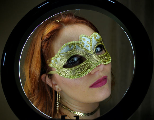 Close-up of young woman wearing mask