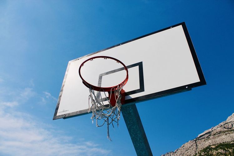 Low angle view of basketball hoop against sky