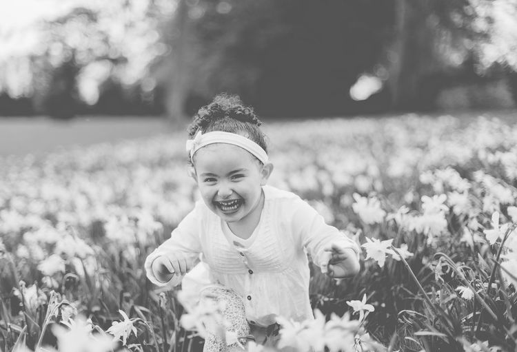 Portrait of happy girl on a meadow