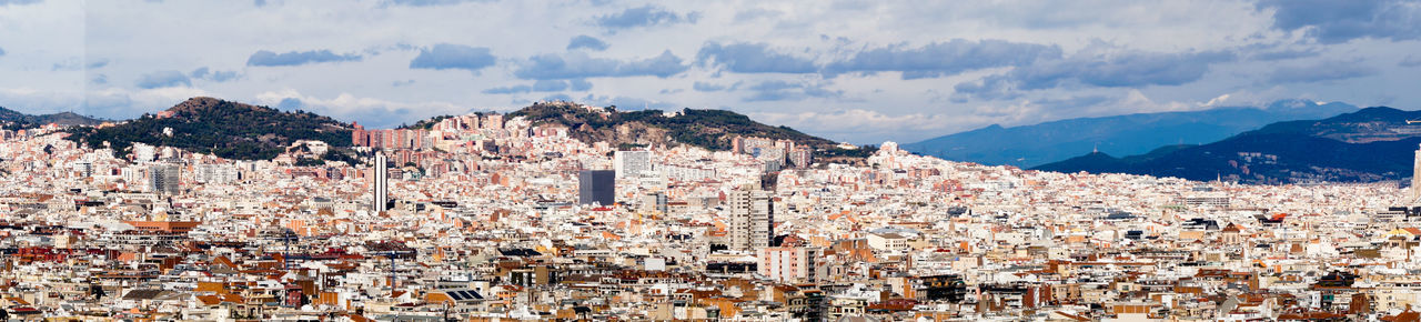 Panoramic shot of townscape against sky, barcelona, spain 
