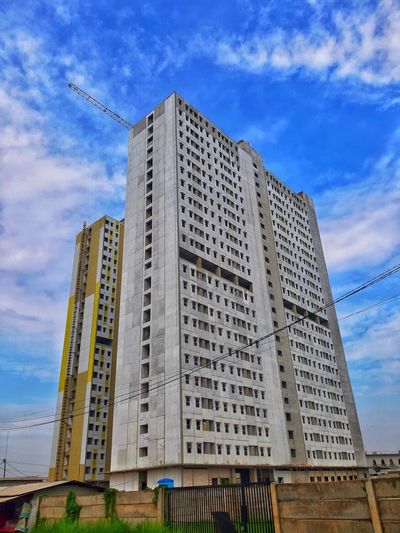 Low angle view of modern buildings against sky