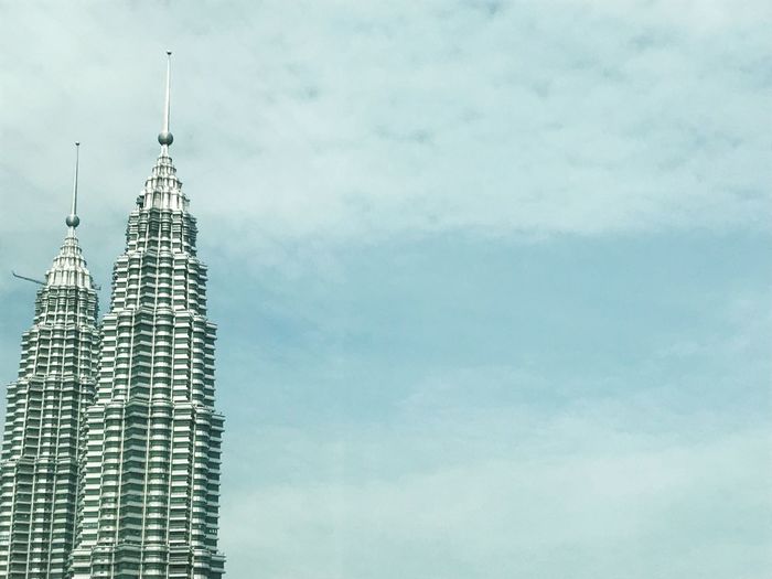 Low angle view of petronas towers against sky