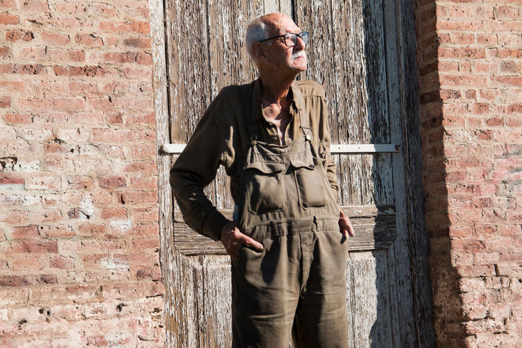 Senior adult man with working clothing