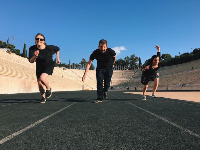 Three people running