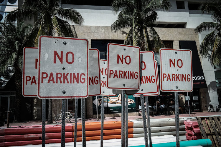 No parking sign against buildings