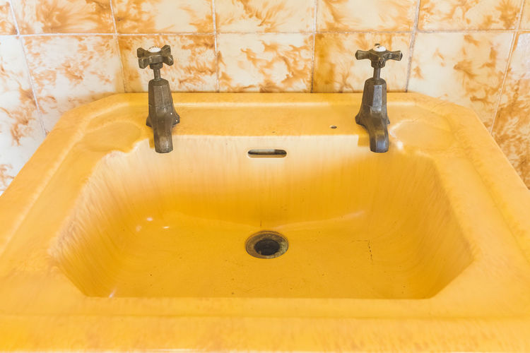 Close-up of faucet in bathroom