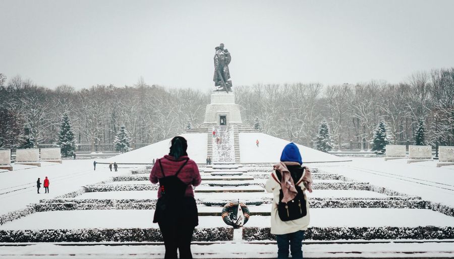 Person standing on snow covered landscape