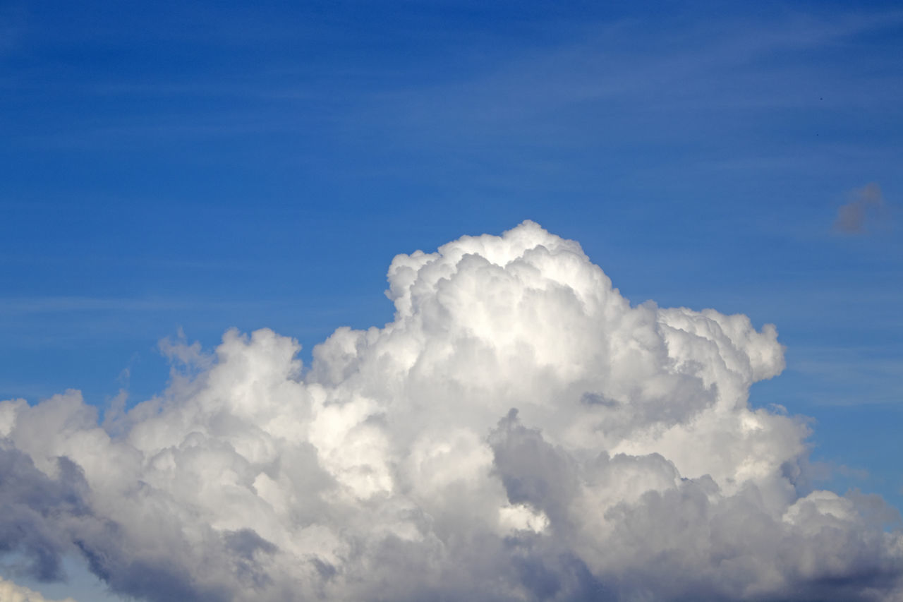 sky, cloud, daytime, blue, cloudscape, nature, white, beauty in nature, environment, atmosphere, no people, fluffy, idyllic, scenics - nature, backgrounds, outdoors, day, tranquility, dramatic sky, high up, spirituality, storm cloud, overcast, religion, cumulonimbus, sunlight, wind, softness, copy space, flying, airplane, tranquil scene