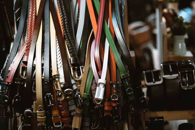 Close-up of belts for sale in store