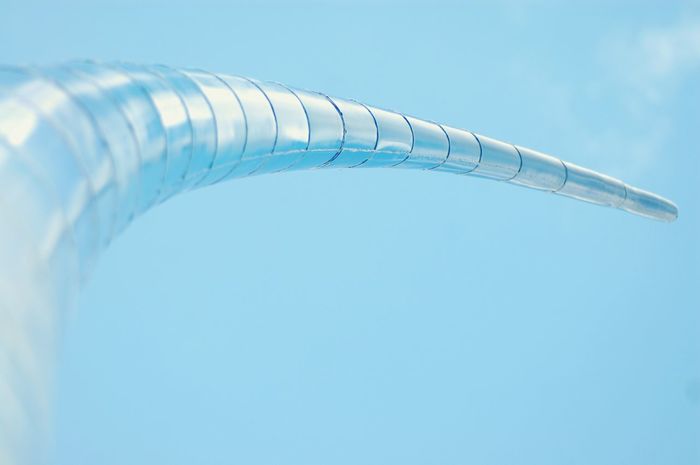 Low angle view of abstract architecture against clear blue sky