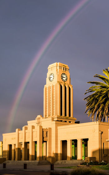 Low angle view of rainbow over building