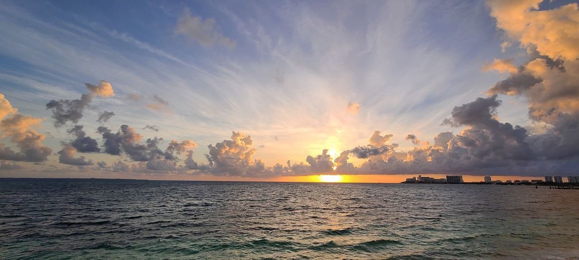 Panoramic view of sea against sky during sunset