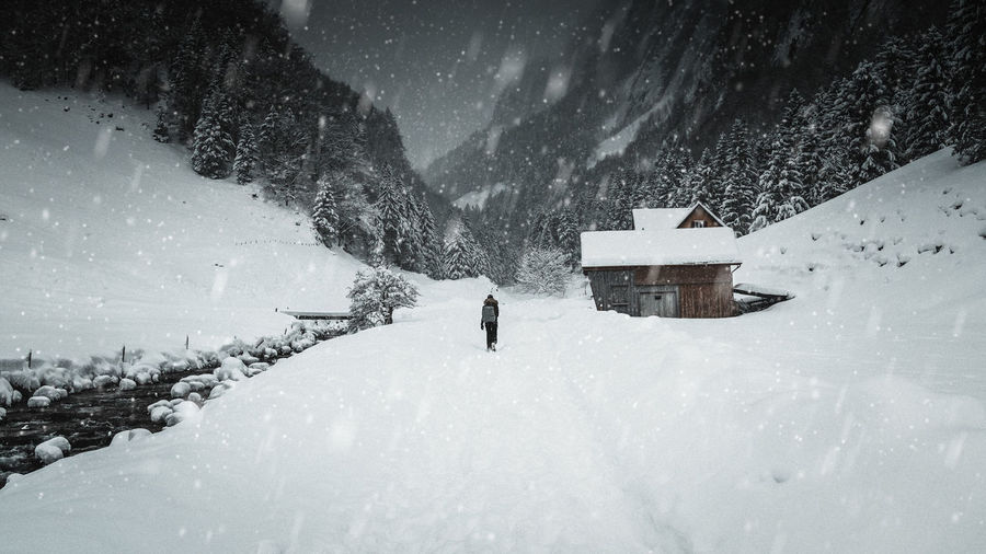 People walking on snow covered land