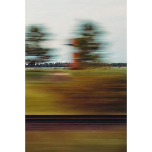 Blurred motion of grass against sky