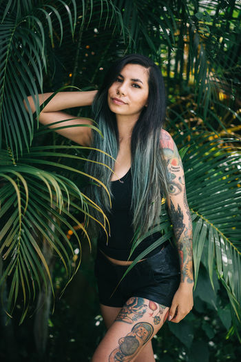 Portrait of smiling young woman in park