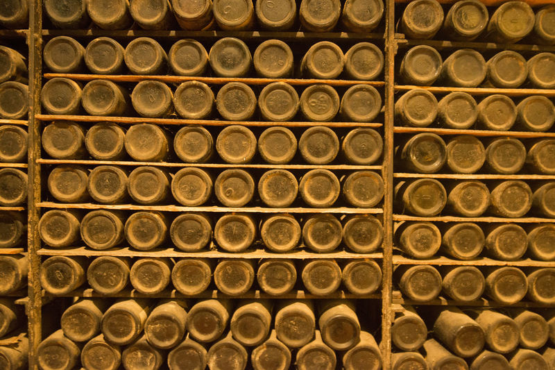 Full frame of bottles on shelves