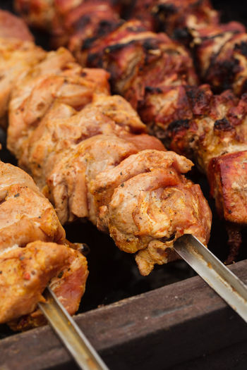 High angle view of meat on barbecue grill