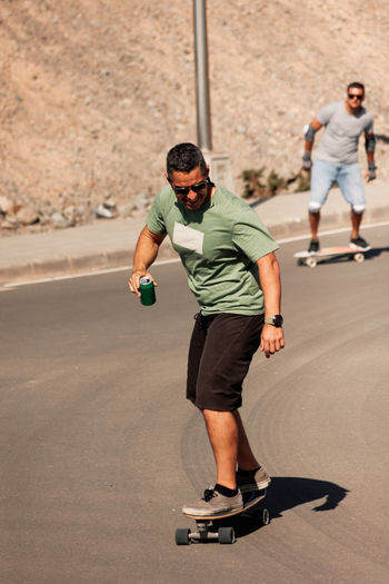 Side view of man exercising on road