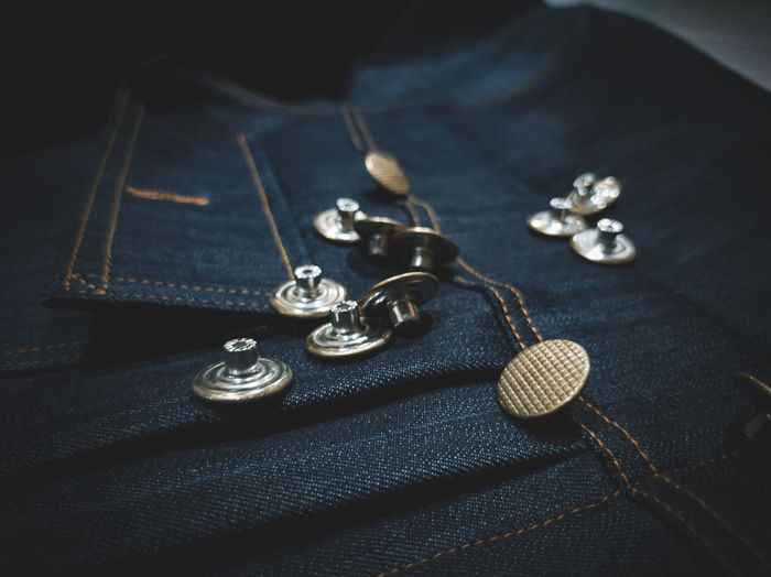 High angle view of buttons on denim
