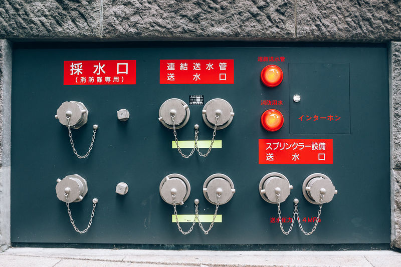 Close-up of telephone booth on wall