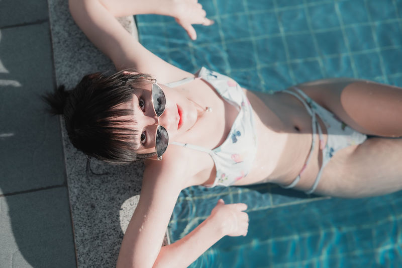High angle portrait of woman in swimming pool