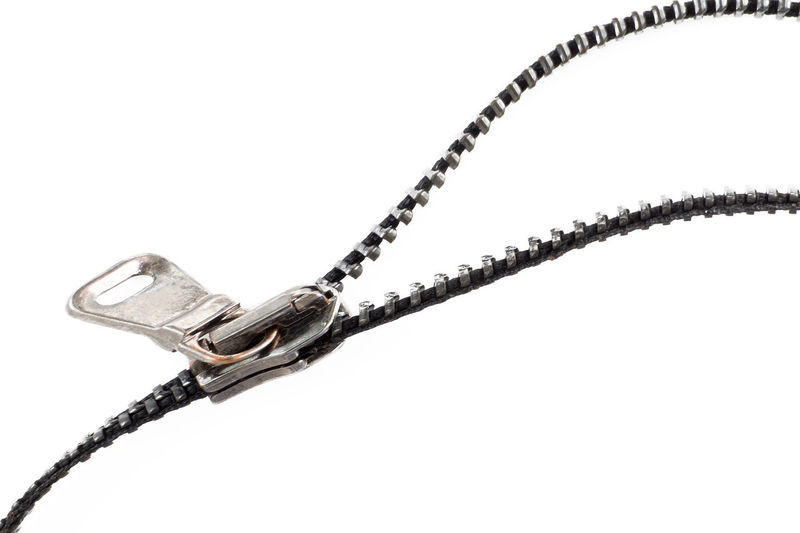 Close-up of chain against white background