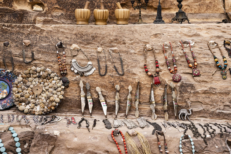 High angle view of antiques for sale on rock formation