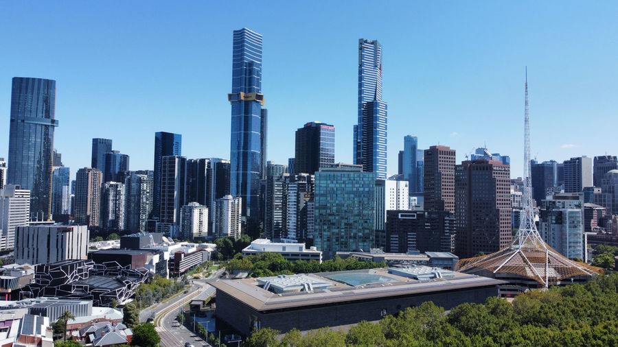 Modern buildings in melbourne city against clear sky