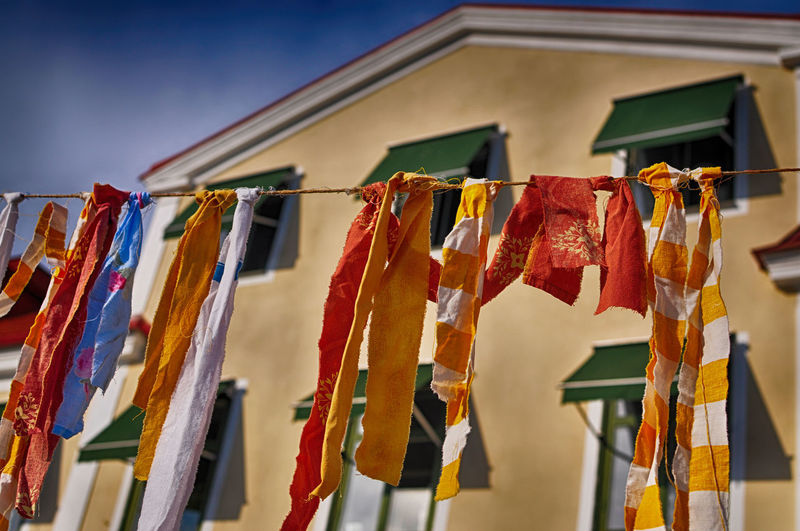 Low angle view of multi colored rags on clothesline
