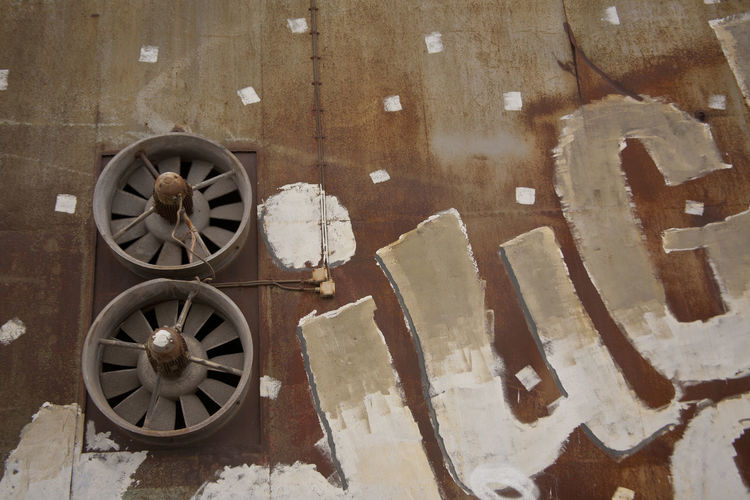 Low angle view of exhaust fans on wall
