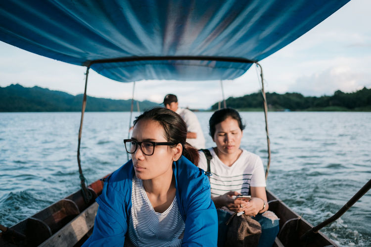 Women sitting in boat on sea