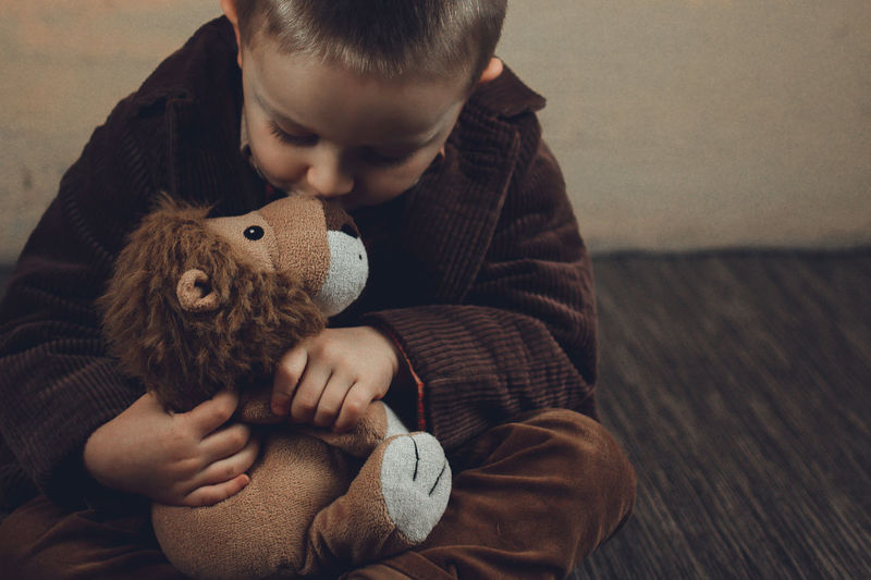 Boy holding stuffed toy