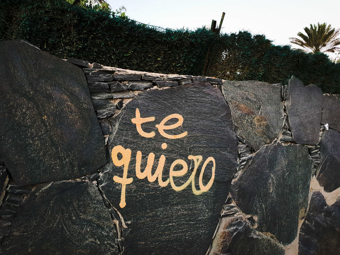 Close-up of text on rock