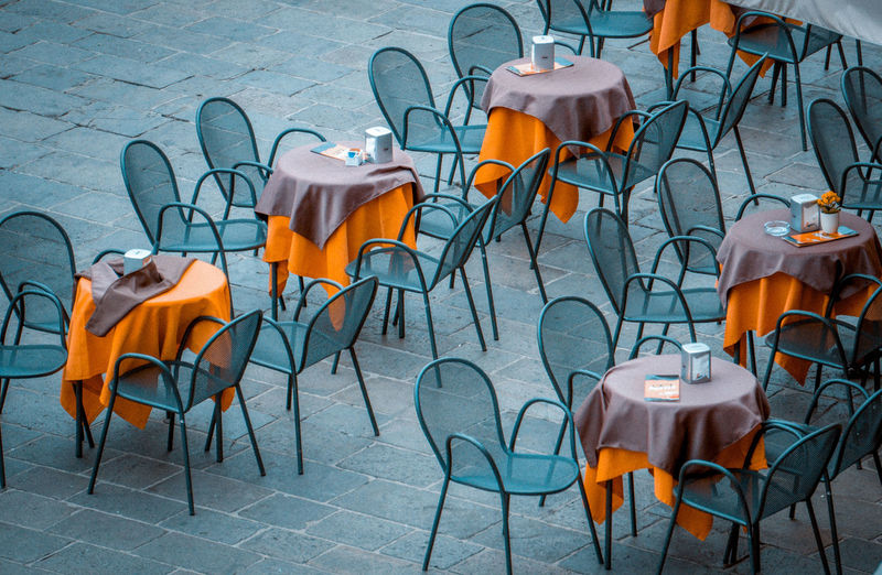 Chairs and tables at sidewalk cafe