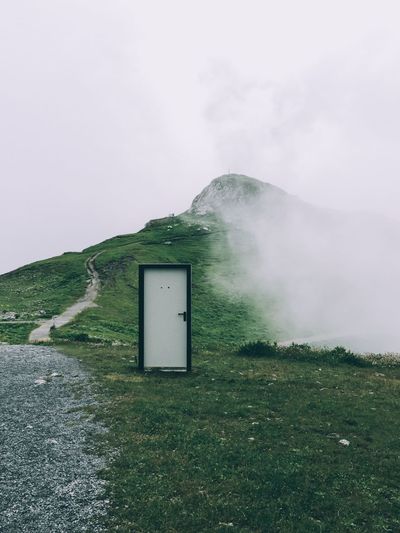 Beauty In Nature Day Door Grass Green Color Landscape Mountain Nature No People Outdoors Sky Technology