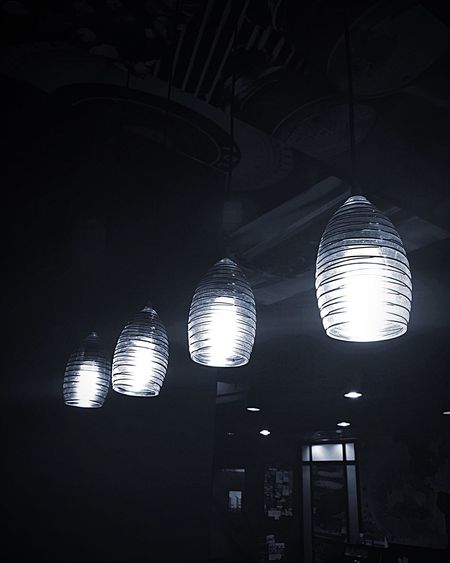 Low angle view of illuminated lights at night