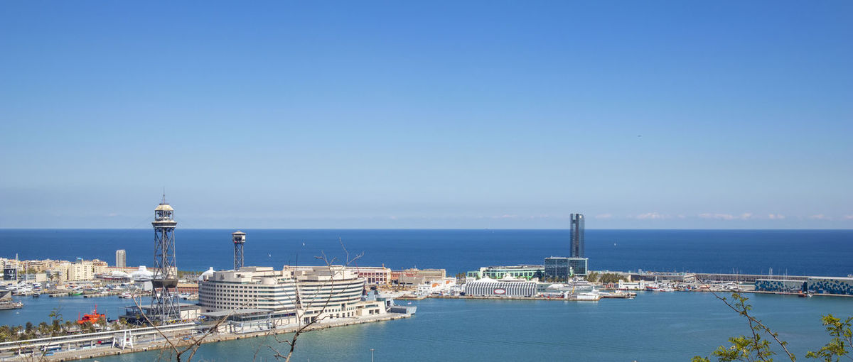 Skyline of barcelona from montjuic mountain overlooking the port and t
